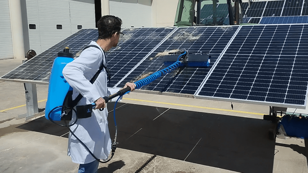 guttergorilla team cleaning a solar panel